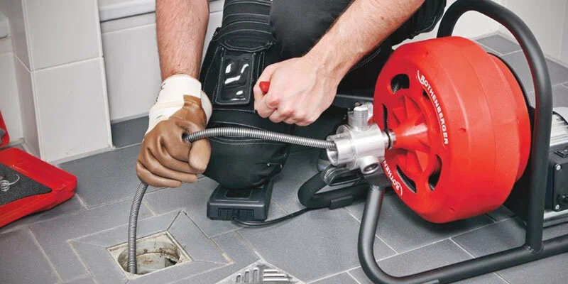 Drain cleaning service in Jupiter, Florida using professional plumbing equipment